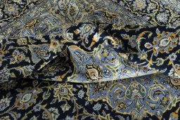 Surface texture of 2000s Kashan rug with natural Wool and intricate pattern