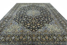 Surface texture of 2000s Kashan rug with natural Wool and intricate pattern