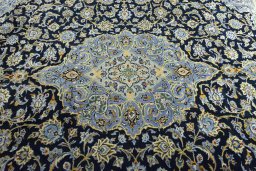 Central medallion detail of 2000s Kashan rug from Iran / Persia