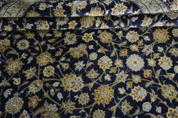 Close-up detail of 2000s Kashan rug from Iran / Persia showing Wool weave