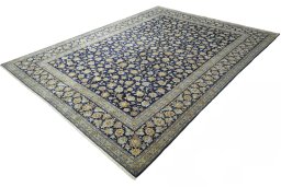 Corner detail of 2000s Kashan rug showing border pattern and Wool pile