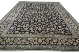 Surface texture of 2000s Kashan rug with natural Wool and intricate pattern