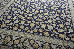 Close-up detail of 2000s Kashan rug from Iran / Persia showing Wool weave