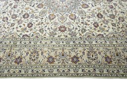 Corner detail of 2000s Kashan rug showing border pattern and Wool pile