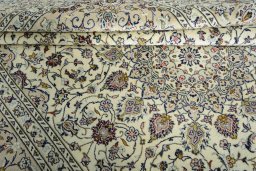 Close-up detail of 2000s Kashan rug from Iran / Persia showing Wool weave