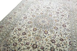 Backside of handmade 2000s Kashan rug showing knot structure and weave density