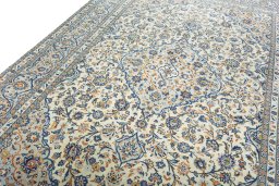 Backside of handmade 2000s Kashan rug showing knot structure and weave density