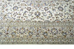 Corner detail of New Kashan rug showing border pattern and Wool pile