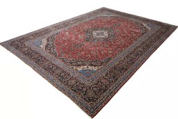 Corner detail of 2000s Kashan rug showing border pattern and Wool pile