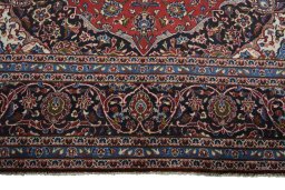 Full view of 2000s Kashan rug from Iran / Persia, 427 × 298 cm in Red tones