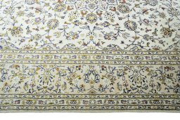 Corner detail of New Kashan rug showing border pattern and Wool pile