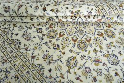 Close-up detail of New Kashan rug from Iran / Persia showing Wool weave