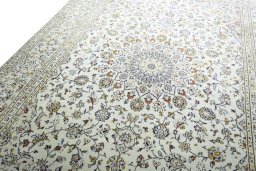 Backside of handmade New Kashan rug showing knot structure and weave density