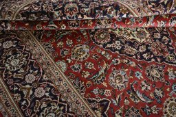 Close-up detail of 2000s Kashan rug from Iran / Persia showing Wool weave