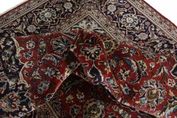 Surface texture of 2000s Kashan rug with natural Wool and intricate pattern