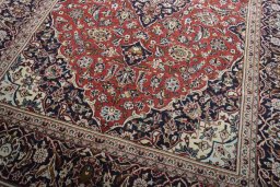 Close-up detail of 2000s Kashan rug from Iran / Persia showing Wool weave