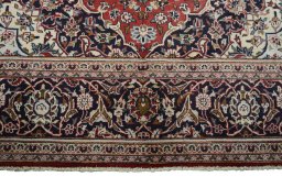 Full view of 2000s Kashan rug from Iran / Persia, 301 × 196 cm in Red tones