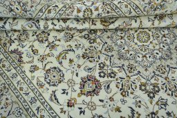 Close-up detail of 2000s Kashan rug from Iran / Persia showing Wool weave