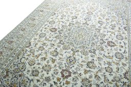 Backside of handmade 2000s Kashan rug showing knot structure and weave density