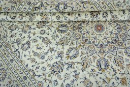 Close-up detail of 2000s Kashan rug from Iran / Persia showing Wool weave