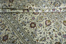 Close-up detail of 2000s Kashan rug from Iran / Persia showing Wool weave