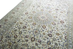 Backside of handmade 2000s Kashan rug showing knot structure and weave density