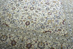 Close-up detail of 2000s Kashan rug from Iran / Persia showing Wool weave