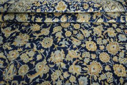 Close-up detail of 2000s Kashan rug from Iran / Persia showing Wool weave