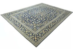 Corner detail of 2000s Kashan rug showing border pattern and Wool pile