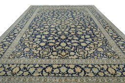 Surface texture of 2000s Kashan rug with natural Wool and intricate pattern