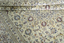 Close-up detail of 2000s Kashan rug from Iran / Persia showing Wool weave