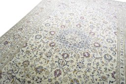 Backside of handmade 2000s Kashan rug showing knot structure and weave density