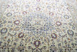 Central medallion detail of 2000s Kashan rug from Iran / Persia