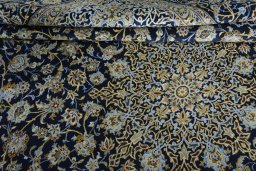 Close-up detail of 2000s Kashan rug from Iran / Persia showing Wool weave