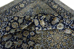 Surface texture of 2000s Kashan rug with natural Wool and intricate pattern
