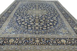Surface texture of 2000s Kashan rug with natural Wool and intricate pattern