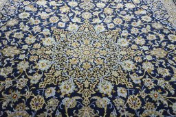 Central medallion detail of 2000s Kashan rug from Iran / Persia