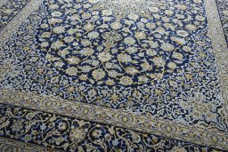 Close-up detail of 2000s Kashan rug from Iran / Persia showing Wool weave