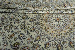 Close-up detail of 2000s Kashan rug from Iran / Persia showing Wool weave
