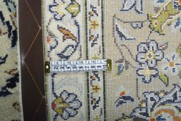 Backside of handmade 2000s Kashan rug showing knot structure and weave density