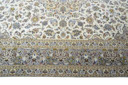 Corner detail of 2000s Kashan rug showing border pattern and Wool pile