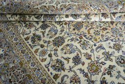 Close-up detail of 2000s Kashan rug from Iran / Persia showing Wool weave