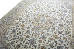 Backside of handmade 2000s Kashan rug showing knot structure and weave density