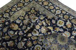 Surface texture of 2000s Kashan rug with natural Wool and intricate pattern
