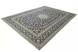 Corner detail of 2000s Kashan rug showing border pattern and Wool pile
