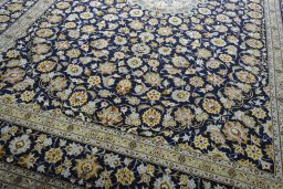 Close-up detail of 2000s Kashan rug from Iran / Persia showing Wool weave