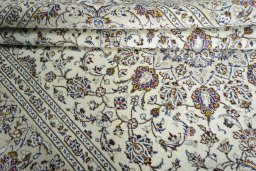 Close-up detail of 2000s Kashan rug from Iran / Persia showing Wool weave