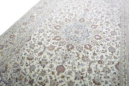 Backside of handmade 2000s Kashan rug showing knot structure and weave density