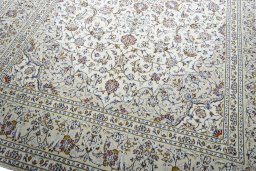 Close-up detail of 2000s Kashan rug from Iran / Persia showing Wool weave