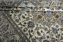 Close-up detail of 2000s Kashan rug from Iran / Persia showing Wool weave